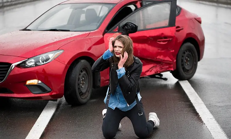 Injured woman feeling bad after having a car crash